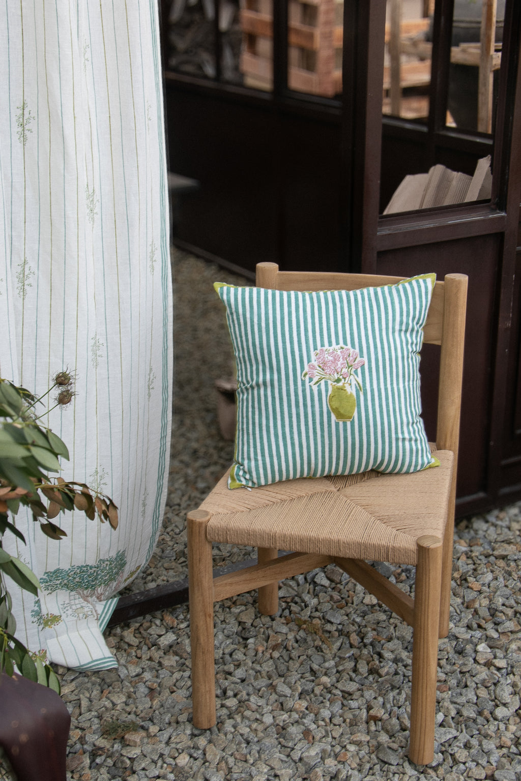 18x18 hand-block printed linen cushion cover with Sea Green stripe and Mona's flower arrangement in between. 