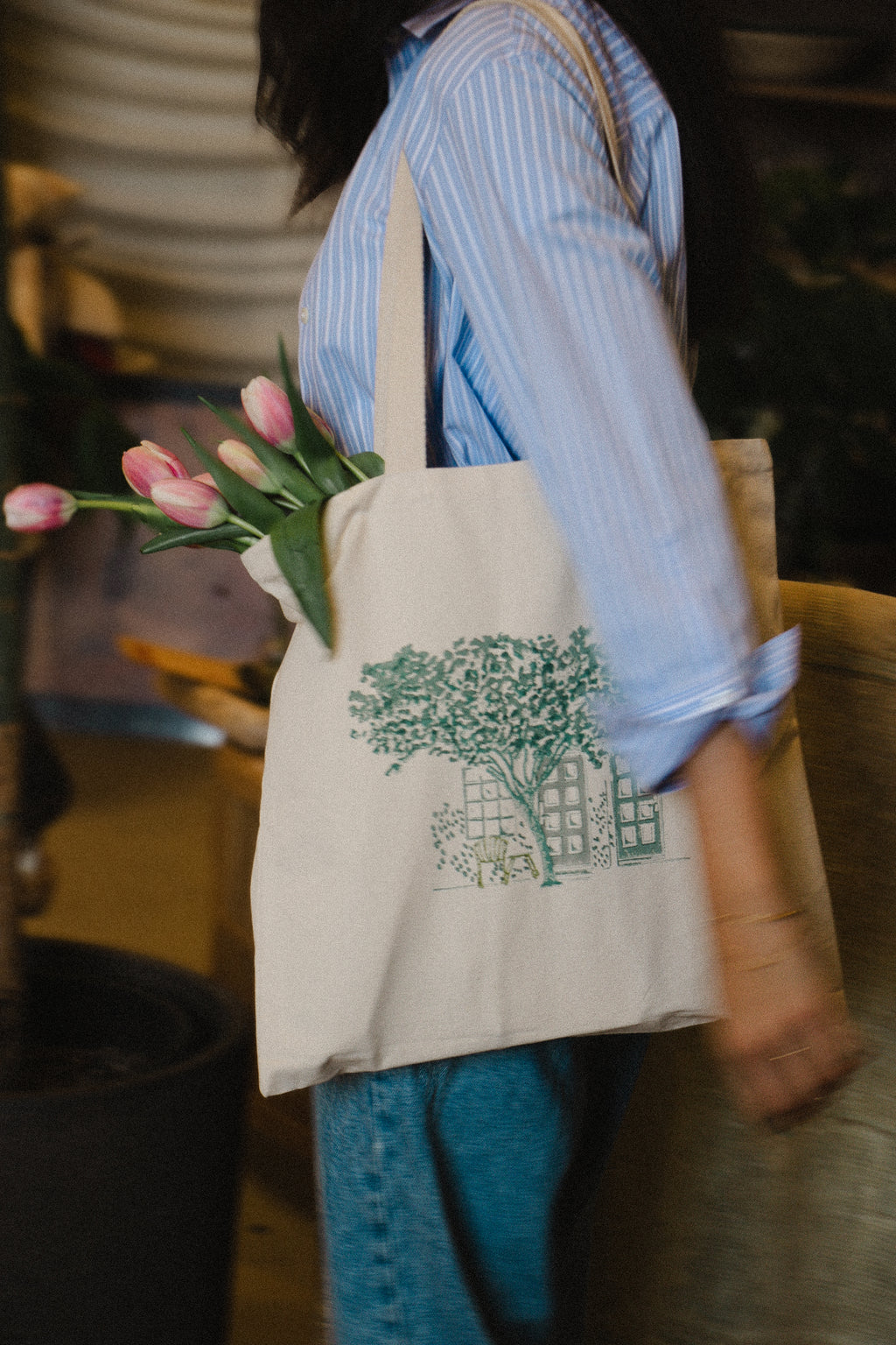 Close-up of intricate hand-carved block print details on a natural fabric tote bag showing organic ink textures.