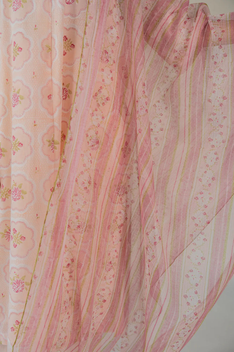 Pink fabric with floral patterns on a light background