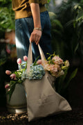 Journey of a River hand-block printed tote bag featuring travel-inspired stories. 