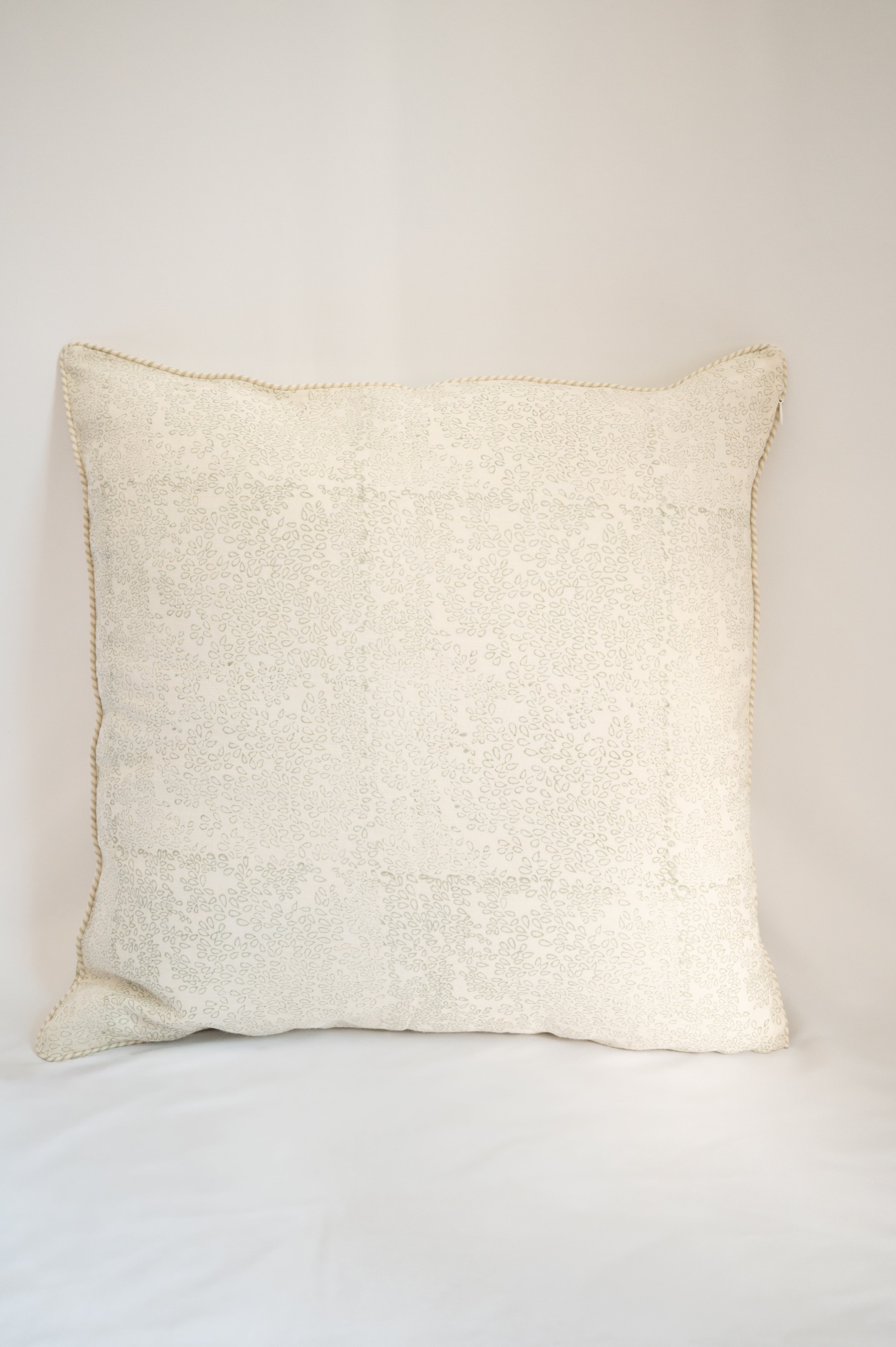 20x20 hand-block printed linen cushion cover with leaf pattern on it and closed using zip 